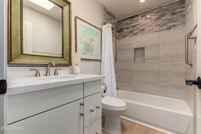 full bathroom with wood-type flooring, vanity, toilet, and shower / bath combo