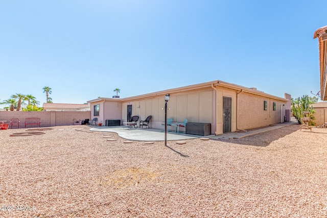 rear view of property featuring a patio