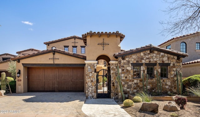 mediterranean / spanish-style house featuring a garage