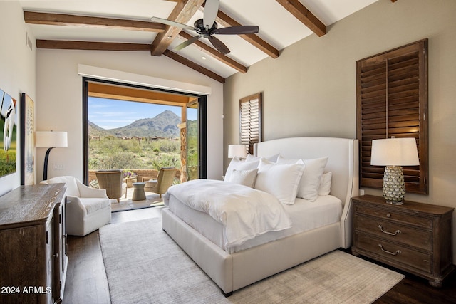 bedroom with vaulted ceiling with beams, a mountain view, ceiling fan, and wood-type flooring