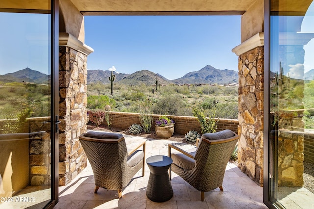 view of patio / terrace with a mountain view