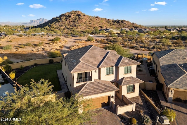 birds eye view of property with a mountain view