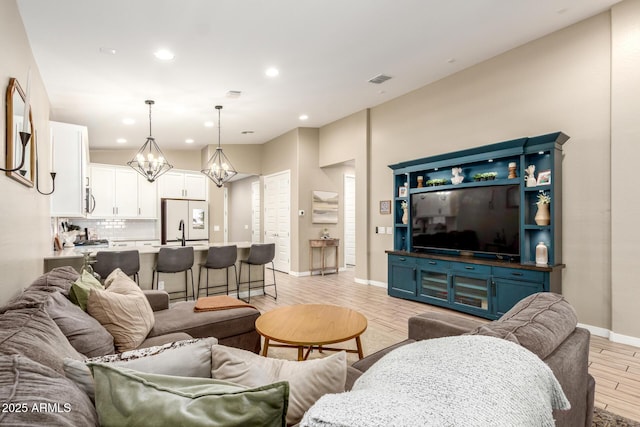 9624 E Thunderbolt Ave, Mesa, AZ 85212 - living area featuring a chandelier, light wood-style flooring, and recessed lighting