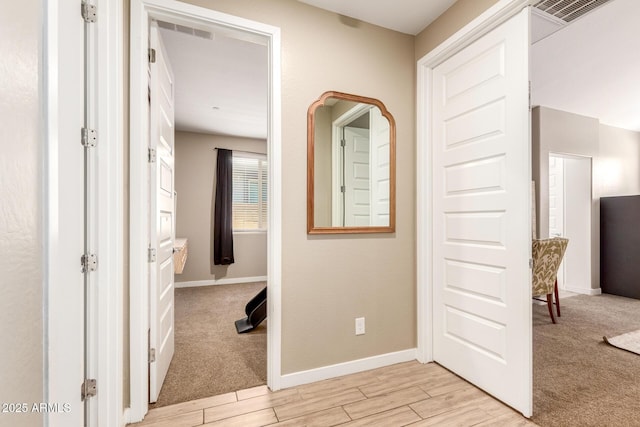 9624 E Thunderbolt Ave, Mesa, AZ 85212 - corridor featuring light wood finished floors and light colored carpet