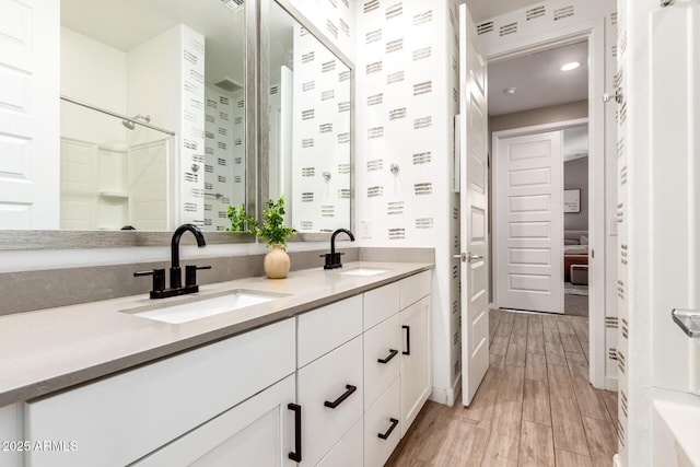 9624 E Thunderbolt Ave, Mesa, AZ 85212 - full bathroom with double vanity, wood finished floors, and a shower