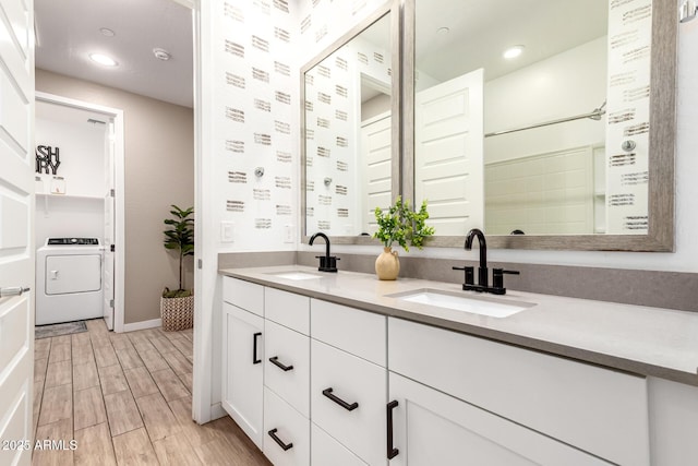 9624 E Thunderbolt Ave, Mesa, AZ 85212 - full bathroom featuring washer / dryer, double vanity, wood finished floors, and recessed lighting