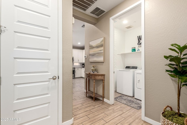 9624 E Thunderbolt Ave, Mesa, AZ 85212 - hallway featuring independent washer and dryer and light wood finished floors