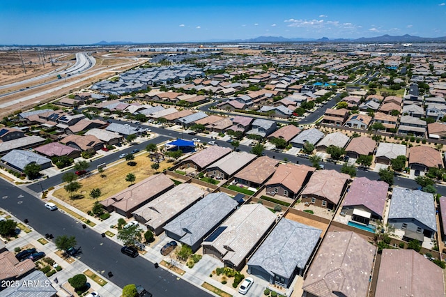 9624 E Thunderbolt Ave, Mesa, AZ 85212 - aerial view of property and surrounding area with a mountain backdrop and nearby suburban area