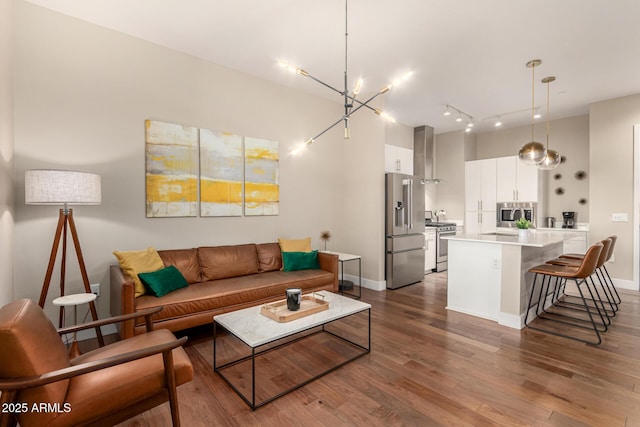 3131 N Central Ave Unit 3004, Phoenix, AZ 85012 - living area with dark wood-style flooring and a chandelier