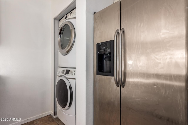 3644 W Maryland Ave, Phoenix, AZ 85019 - laundry room featuring stacked washing machine and dryer and baseboards