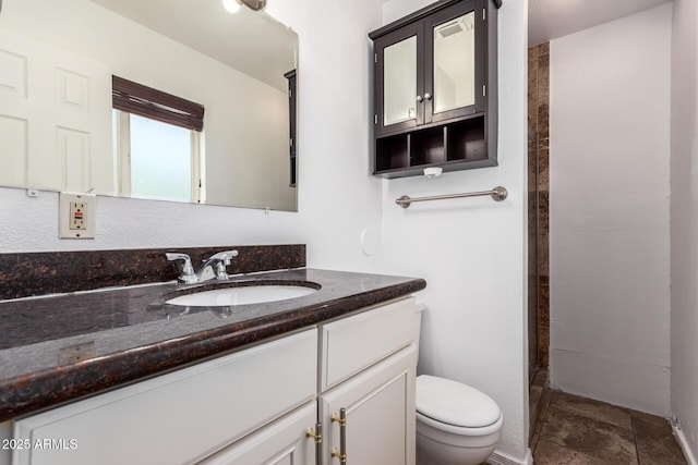 3644 W Maryland Ave, Phoenix, AZ 85019 - full bathroom featuring toilet, vanity, and a tile shower