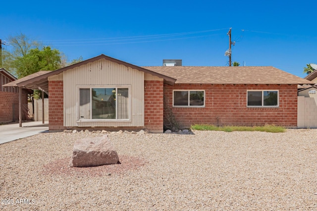 3644 W Maryland Ave, Phoenix, AZ 85019 - rear view of property with a shingled roof and brick siding