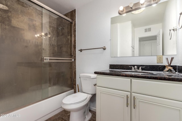 3644 W Maryland Ave, Phoenix, AZ 85019 - full bathroom with vanity, toilet, and combined bath / shower with glass door