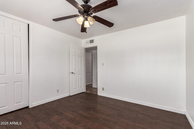 3644 W Maryland Ave, Phoenix, AZ 85019 - unfurnished bedroom with baseboards, dark wood-style floors, and a ceiling fan
