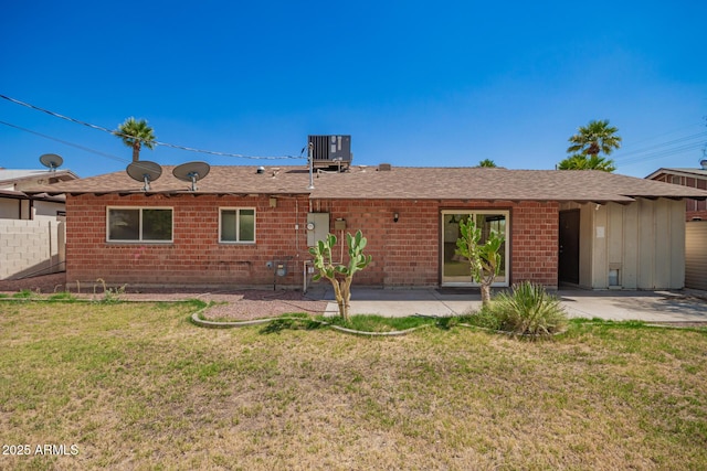 3644 W Maryland Ave, Phoenix, AZ 85019 - rear view of house with a patio, brick siding, central AC unit, and roof with shingles