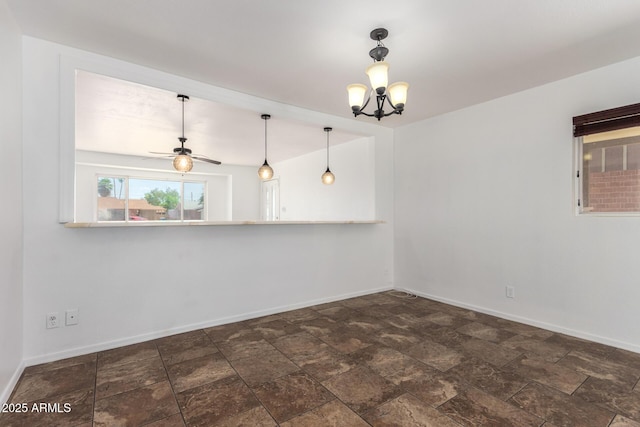 3644 W Maryland Ave, Phoenix, AZ 85019 - unfurnished room with baseboards, a chandelier, dark stone finish flooring, and ceiling fan