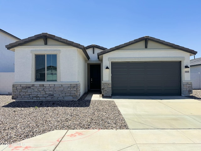 5019 W Walatowa St, Laveen, AZ 85339 - ranch-style house with a garage, driveway, and stone siding
