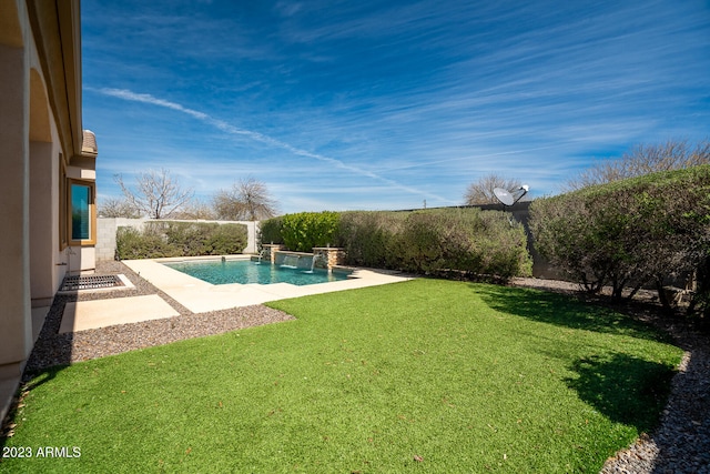 view of swimming pool featuring a lawn and pool water feature