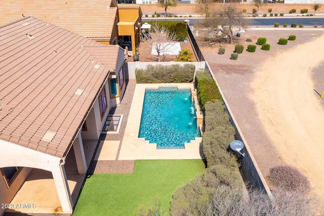 view of pool featuring pool water feature and a patio