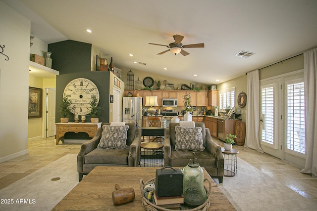 living room with ceiling fan and lofted ceiling