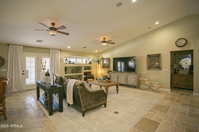 living room featuring vaulted ceiling and ceiling fan