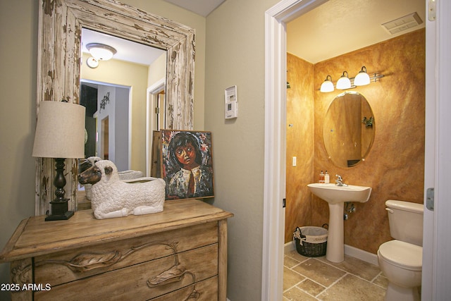 bathroom with toilet and sink