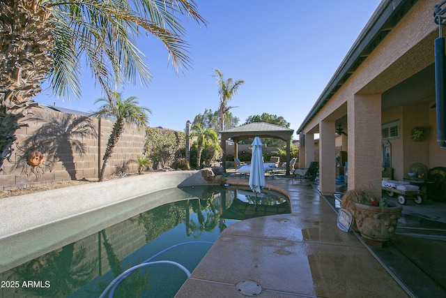 view of pool with a gazebo and a patio