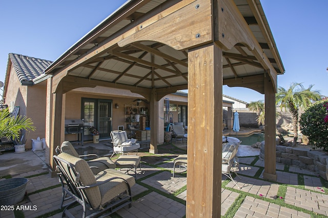 view of patio / terrace with grilling area and a gazebo