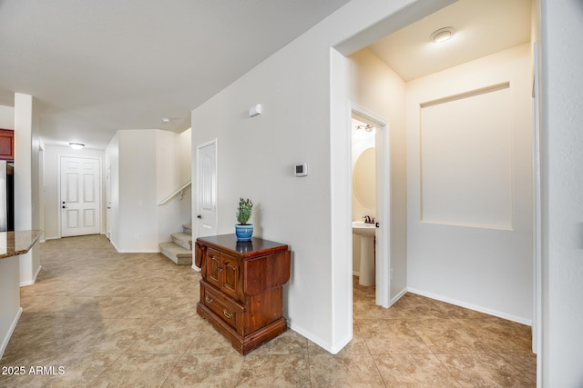 hallway with light tile patterned floors