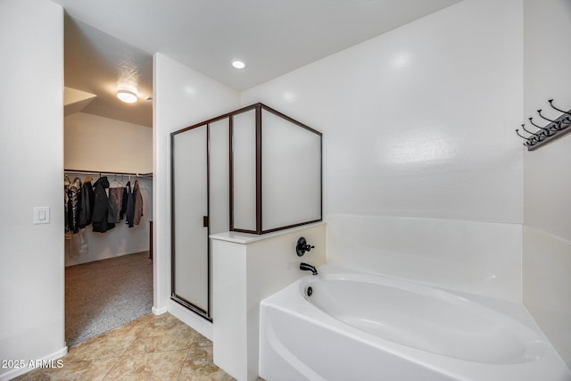 bathroom featuring a bathtub and tile patterned flooring