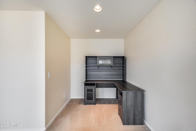 unfurnished office featuring light colored carpet