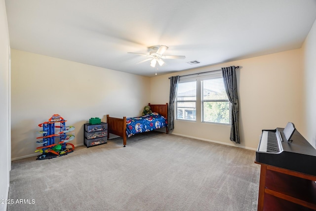 bedroom with ceiling fan and light carpet