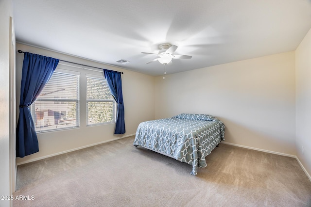 bedroom featuring ceiling fan and light colored carpet