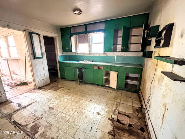 216 W Third St, Winslow, AZ 86047 - kitchen featuring green cabinets, plenty of natural light, and light flooring