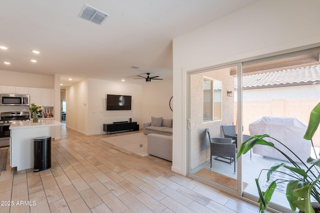 948 E Wiley Way, Casa Grande, AZ 85122 - living area with ceiling fan, recessed lighting, and baseboards