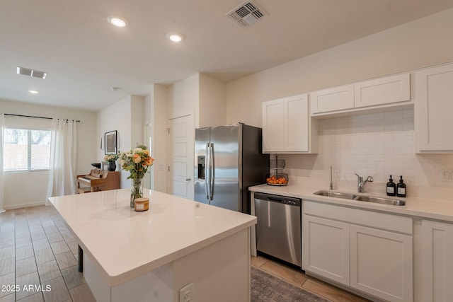 948 E Wiley Way, Casa Grande, AZ 85122 - kitchen featuring appliances with stainless steel finishes, a sink, tasteful backsplash, light countertops, and recessed lighting