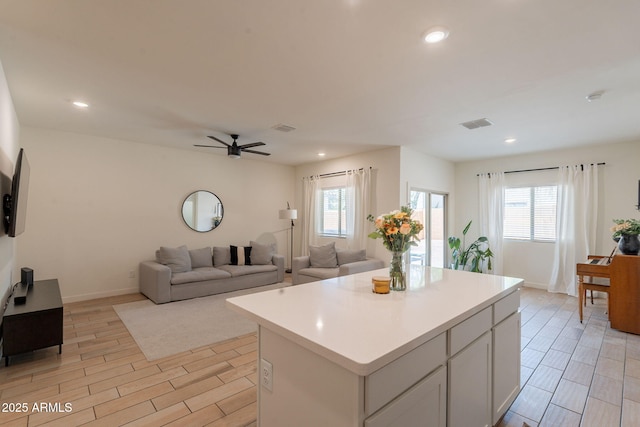 948 E Wiley Way, Casa Grande, AZ 85122 - kitchen with plenty of natural light, a kitchen island, light countertops, and recessed lighting