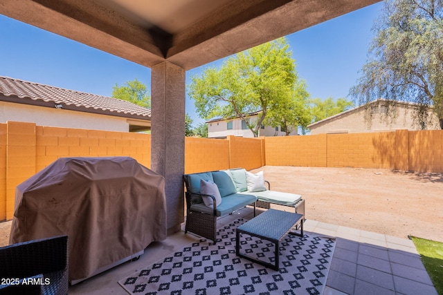 948 E Wiley Way, Casa Grande, AZ 85122 - fenced backyard with an outdoor hangout area, grilling area, and a patio area