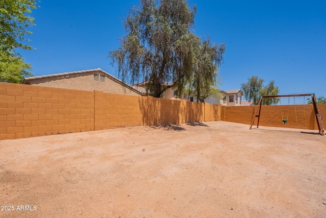 948 E Wiley Way, Casa Grande, AZ 85122 - fenced backyard featuring a playground