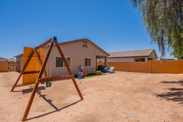 948 E Wiley Way, Casa Grande, AZ 85122 - back of property featuring a fenced backyard and stucco siding