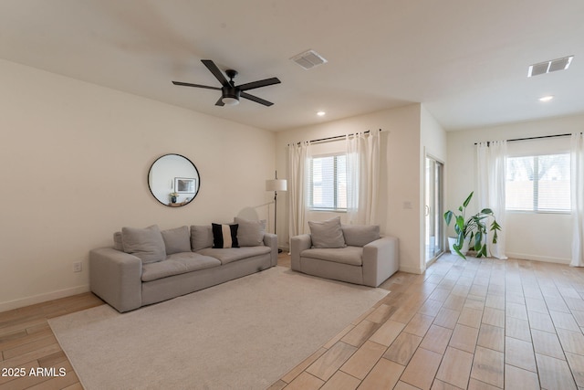 948 E Wiley Way, Casa Grande, AZ 85122 - living area featuring light wood-type flooring, plenty of natural light, a ceiling fan, baseboards, and recessed lighting