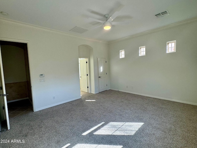 unfurnished bedroom with ornamental molding, ceiling fan, and carpet flooring