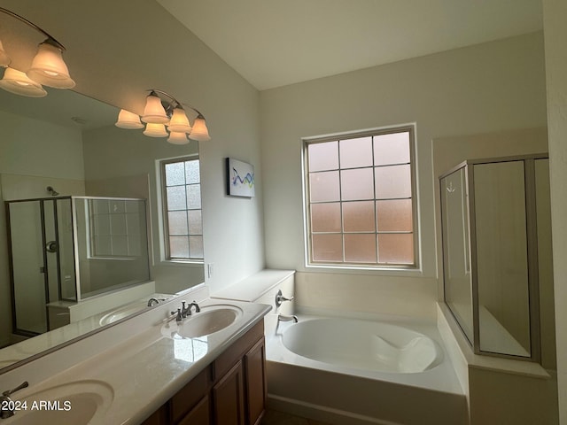 bathroom featuring vanity and separate shower and tub