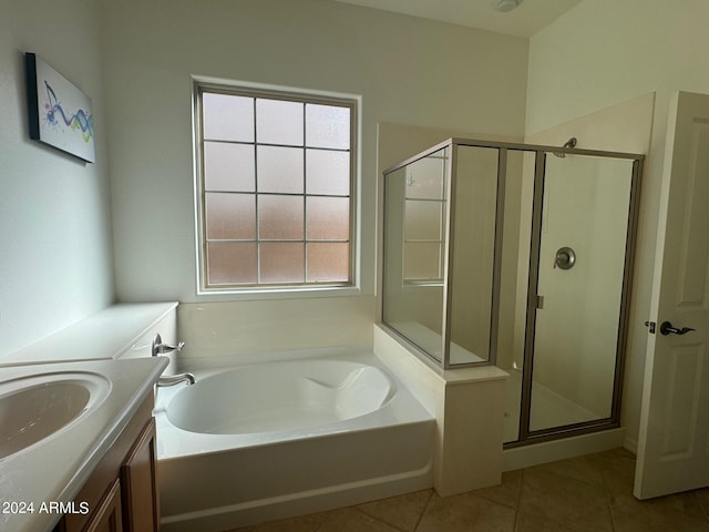 bathroom with shower with separate bathtub, tile patterned flooring, and vanity