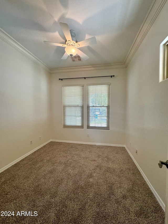 unfurnished room with ornamental molding, carpet, and ceiling fan