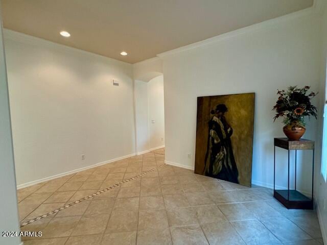 tiled empty room with ornamental molding