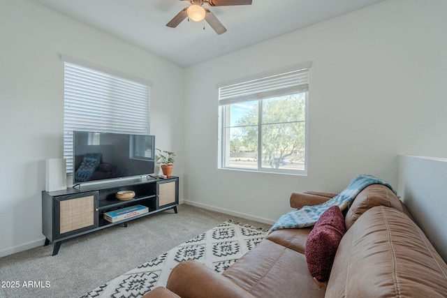 living room with ceiling fan and light carpet