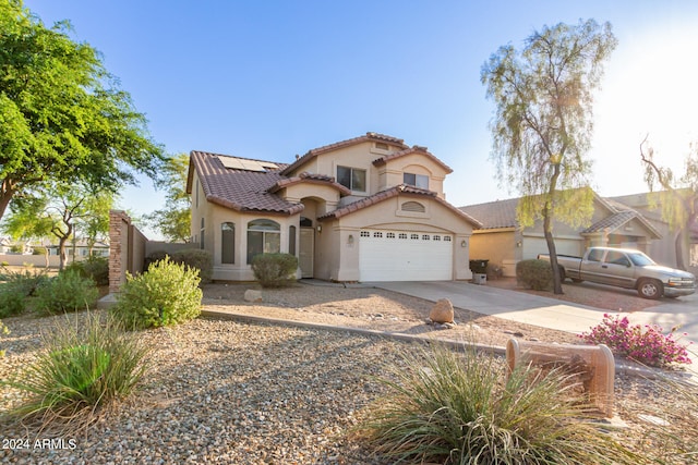 mediterranean / spanish-style house featuring a garage