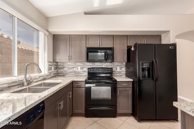 1379 E Butler Cir, Chandler, AZ 85225 - kitchen featuring black appliances, tasteful backsplash, light tile patterned floors, and light stone countertops