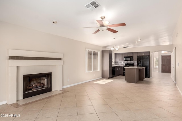 1379 E Butler Cir, Chandler, AZ 85225 - kitchen with black appliances, open floor plan, light tile patterned flooring, ceiling fan, and lofted ceiling
